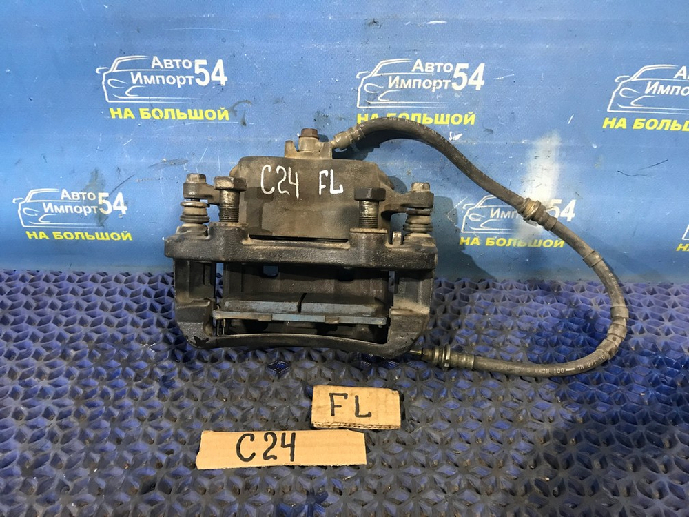 Суппорт тормозной передний левый NISSAN SERENA 2000