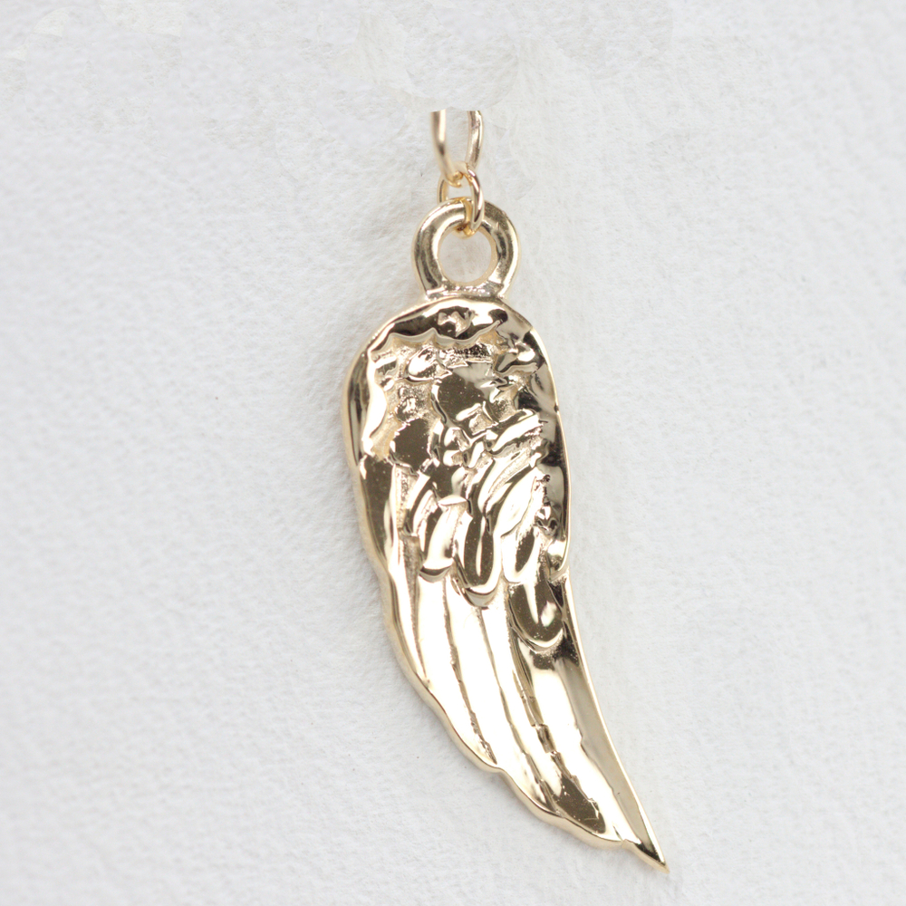 Wing charm on sale