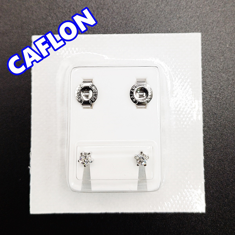Серьги-гвоздики для прокола ушей под пистолет. CAFLON (Англия). Серебристые с прозрачными кристаллами, крапление