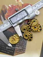 Пуговицы Скиапар. золотистые с черной эмалью в форме ракушки