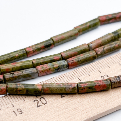 Унакит бусины, размер около 13,5*4 мм, цена за 13 шт (1/2 нити)