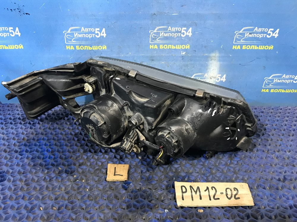 Фара передняя левая NISSAN LIBERTY 1999