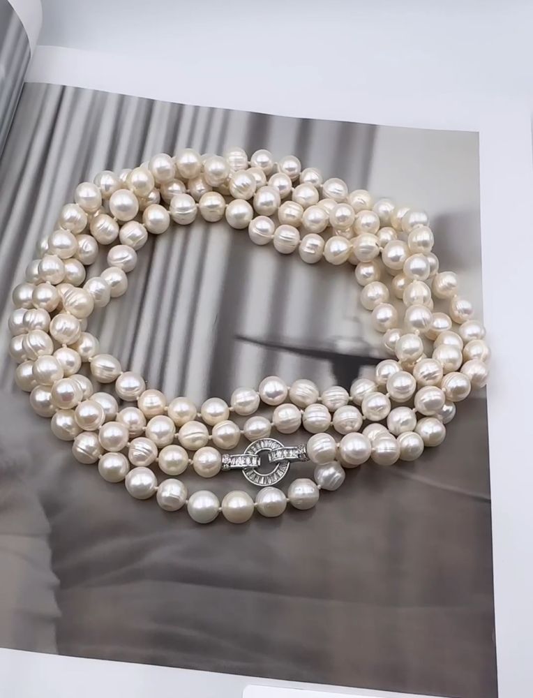 Нить натурального речного жемчуга 9 мм на двойном узле, серебряный замок из цирконов, длина 1,6 м Нить натурального речного жемчуга 9 мм на двойном узле, серебряный замок из цирконов, длина 1,6 м