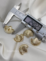 Пуговицы Скиапар. золотистые в форме ракушки