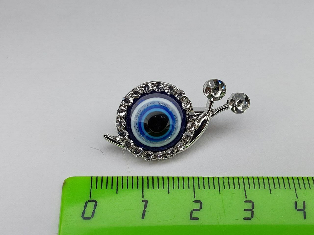 Брошка. Улитка. Глаз Фатимы. цвет " Серебро"