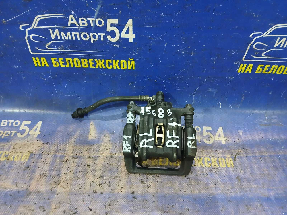 Суппорт тормозной задний левый Honda STEPWGN 1996-2001