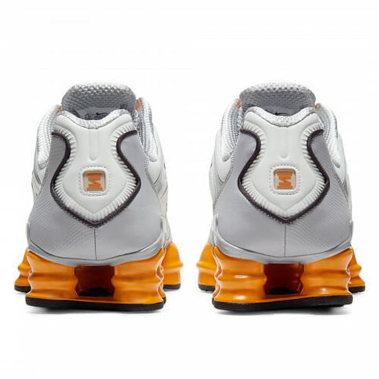 white and orange shox