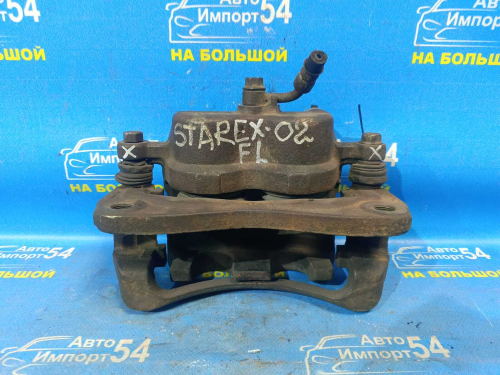 Суппорт тормозной передний левый HYUNDAI STAREX 2003