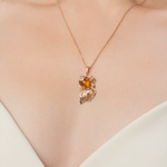 Подвеска «Рыбка» из красного золота с янтарём