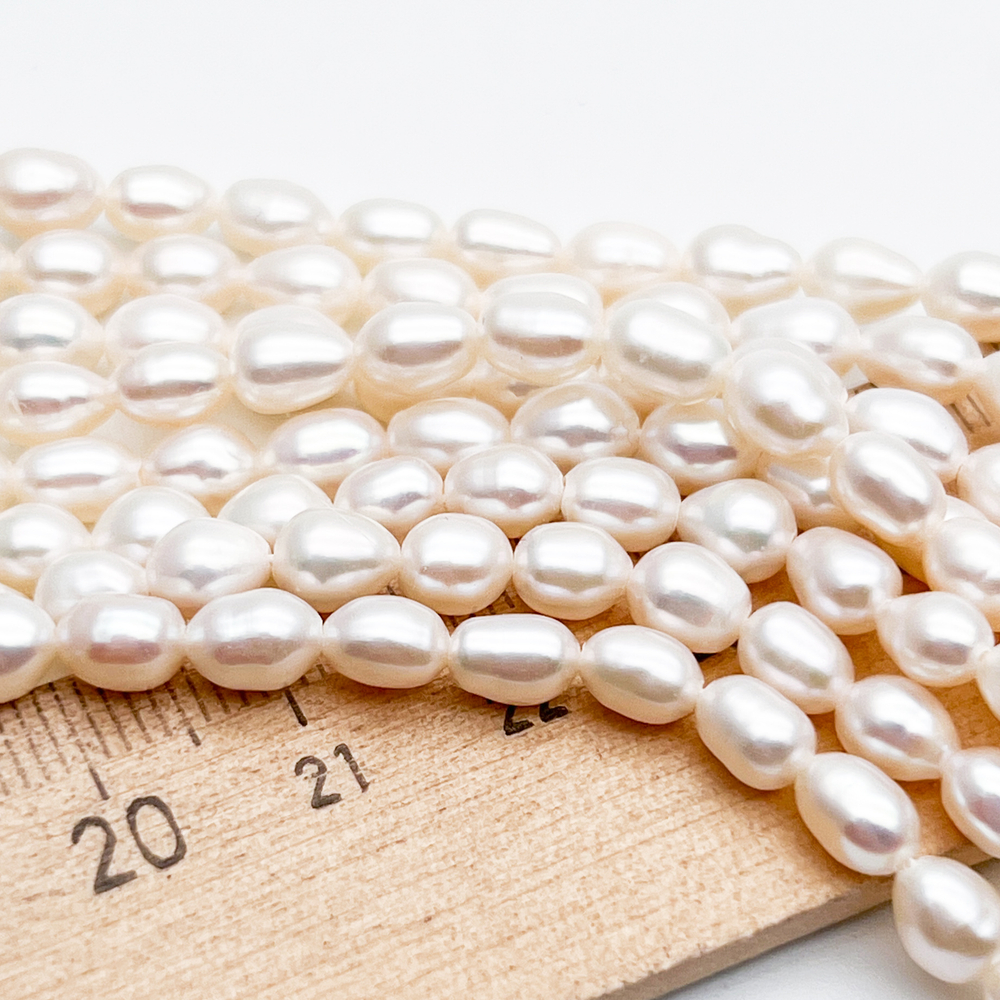 Жемчуг Рис бусины, размер около 6-6,3*4,5-5 мм, цена за отрезок 18 см (1/2 нити)