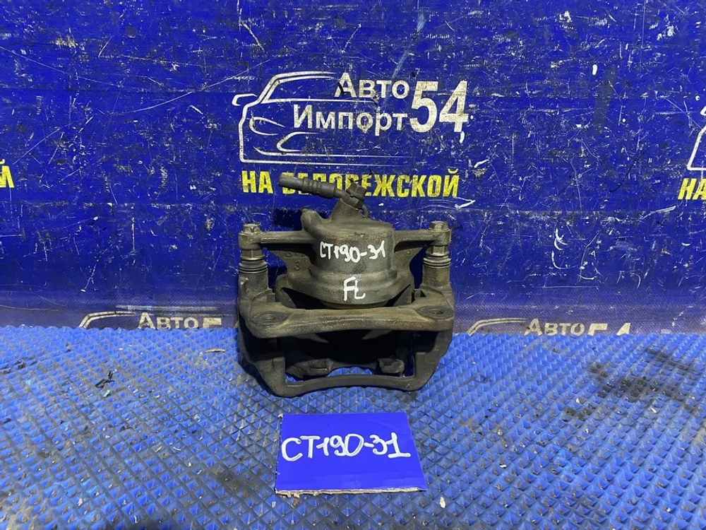 Суппорт тормозной передний левый TOYOTA CALDINA 1994