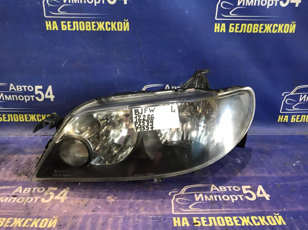 Фара передняя левая MAZDA FAMILIA 2000-2003