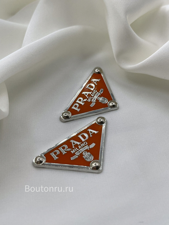 Логотип металлический Прад. серебро с оранжевым