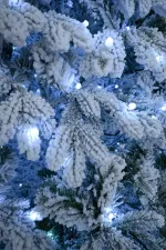 Заснеженная елка с гирляндой «Камчатская» холодный свет (Литая+пвх) от 1,8 до 5 м