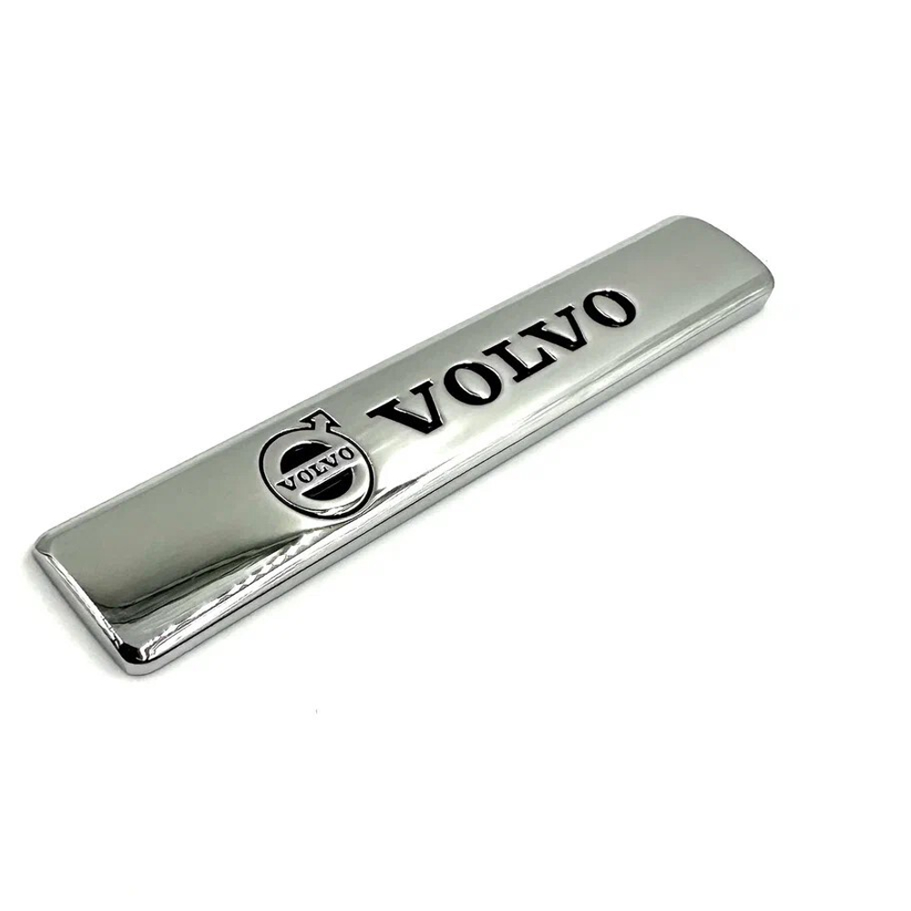 Наклейка Volvo объемная (шильдик Вольво, 9х2,5см). Серебристая с черной надписью