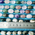 Лазурит с включениями пирита, крупная галтовка, 12-15 мм, камни овалы, цена за нить 12.5 - 13 см (1/3 нити)