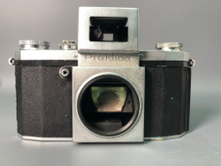 Praktica + Biometar 5,8cm 1:2, зеркало исцарапано, присутствуют пузырьки воздуха.