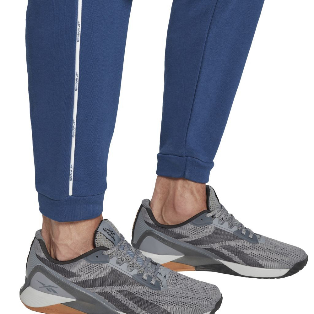 Теннисные брюки Reebok Wor Piping Jogger M - batik blue