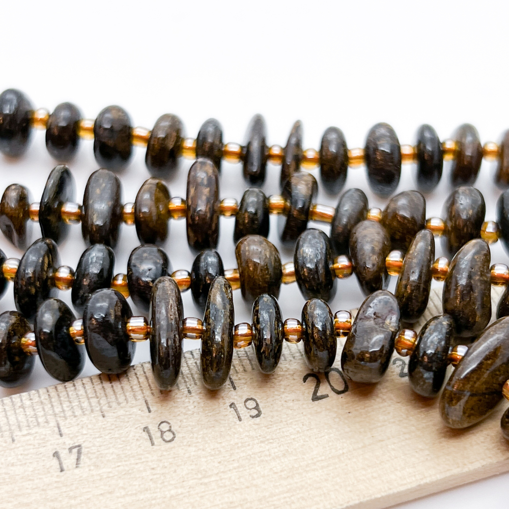 Бронзит бусины, галтовка, размер около 9-13*2,5-5 мм, цена за отрезок 19 см (1/2 нити)