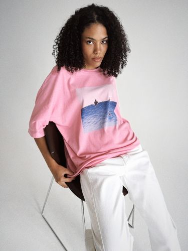 Розовая футболка оверсайз с принтом