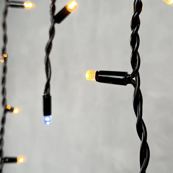 Светодиодная бахрома с колпачком 3,1*0,5 м., 120 экстра теплых белых LED ламп, мерцание, каучуковый черный провод, LTC (LL120BLW-1-2EWW)