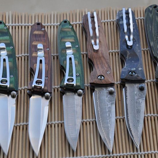 Складной нож Mcusta Damascus Elit Tactility MC-0123D c клинком из стали VG-10 San Mai (Laminated Stainlesss Damascus) рукоять Corian