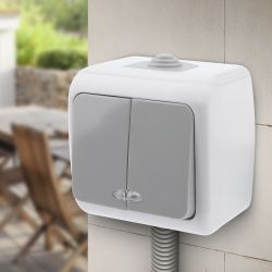 Выключатель Intro Atlantic 5-105-03 двойной с подсветкой, 10А-250В, IP54, открытой установки, серый | Intro