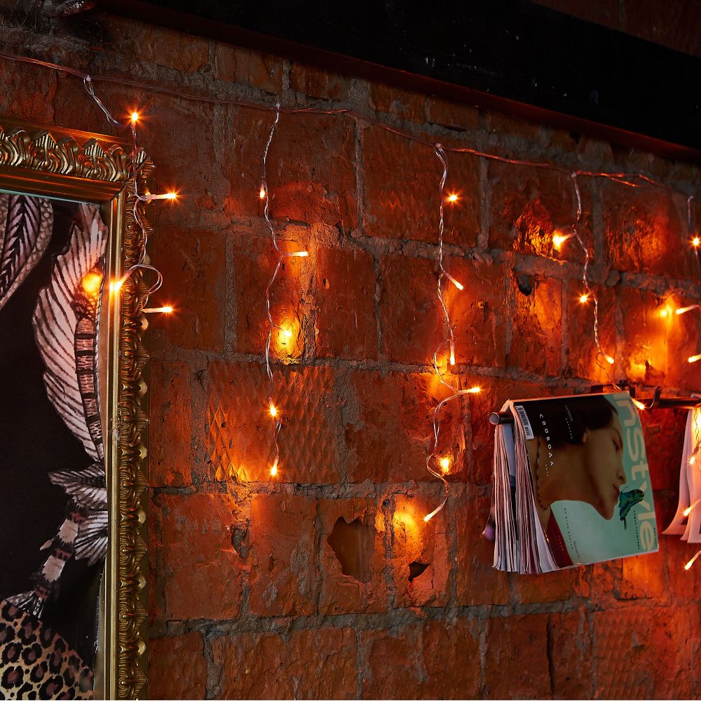 ULD-B12006-195-TTK AMBER IP44 Бахрома светодиодная с эффектом мерцания. 12м. Соединяемая. 195 светодиодов. Янтарный свет. Провод прозрачный. ТМ Uniel