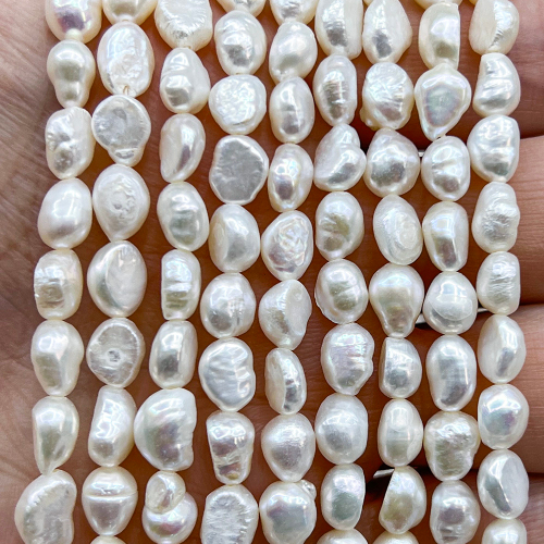 Жемчуг 2А речной бусины 5-6 мм, на нитке 38 см