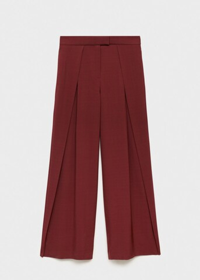 Костюмные брюки с широкими штанинами и защипами