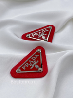 Логотип металлический Прад. красный на коже серебро