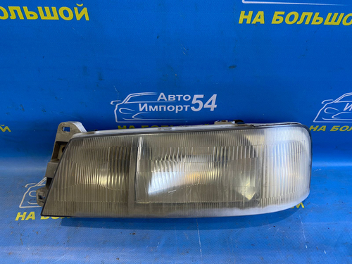 Фара передняя левая NISSAN LARGO 1993