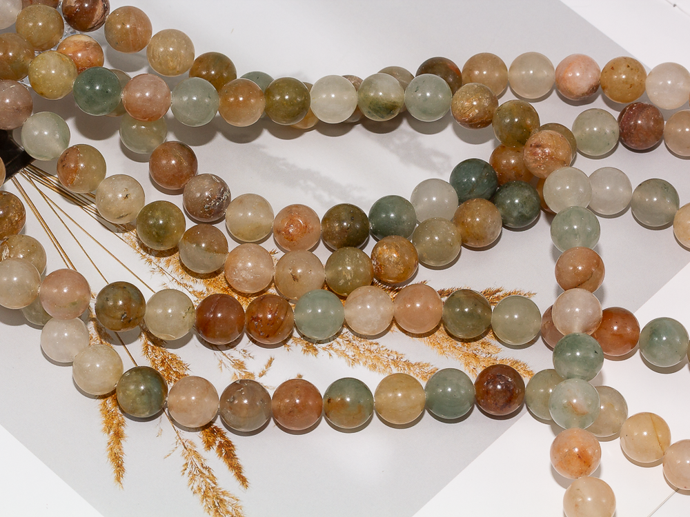 Нить бусин из тонированного кварца 10,5мм