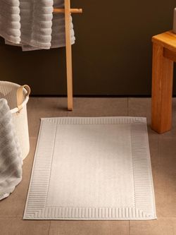 Коврик для ванной с фактурным бортиком кремового цвета из коллекции Essential, 50x80 см