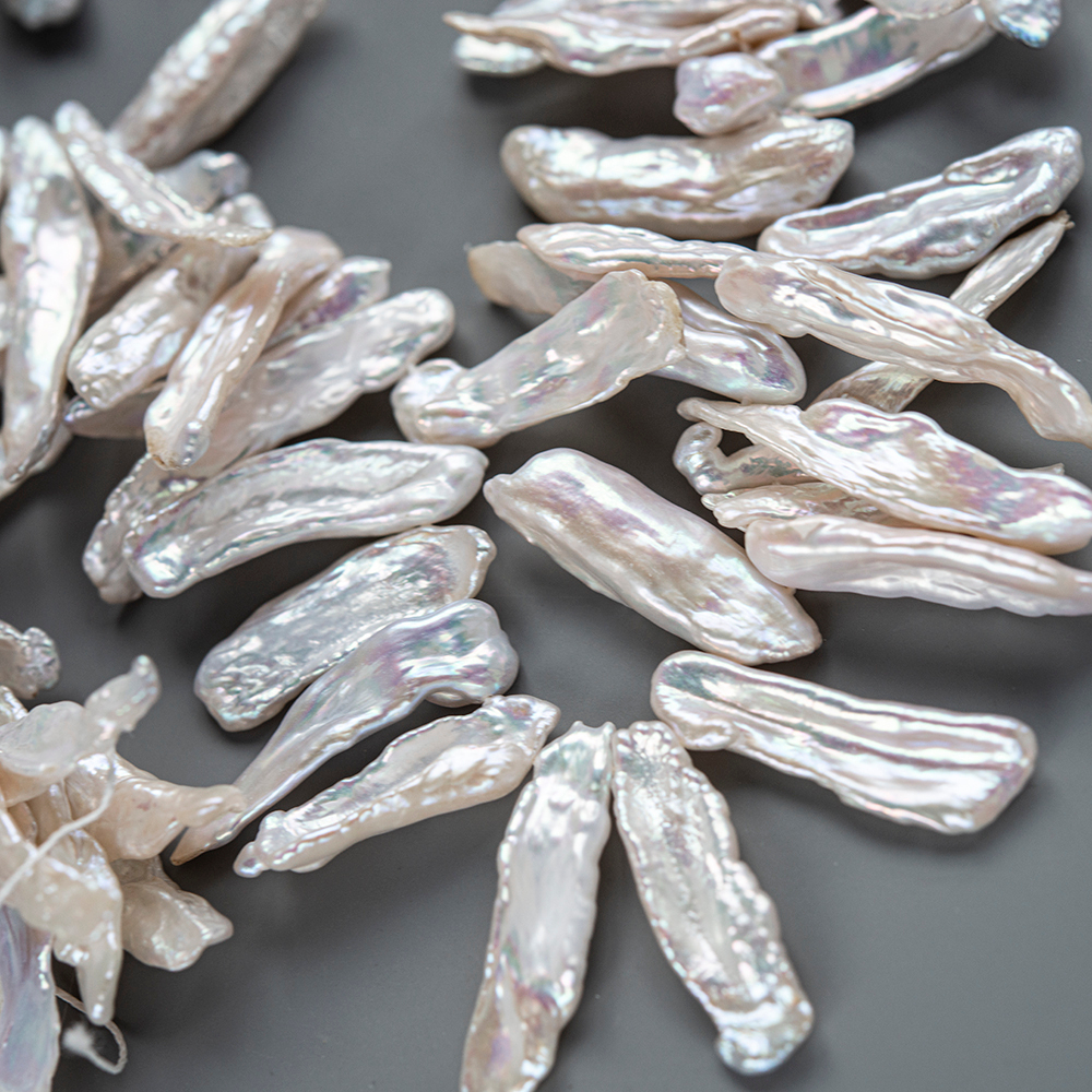 Жемчуг культивированный Бива, белый, со смещенным боковым отверстием 14-38мм