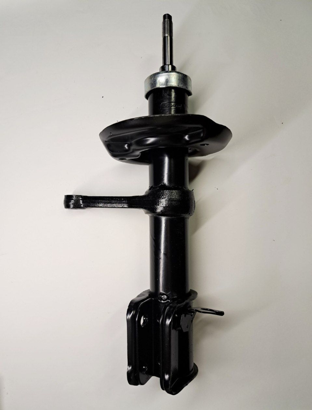 Стойка амортизатора передняя правая 1119-2905402 Птимаш