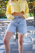 Джинсовые шорты рваные снизу оптом