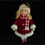 Фарфоровая кукла в празничном платьице