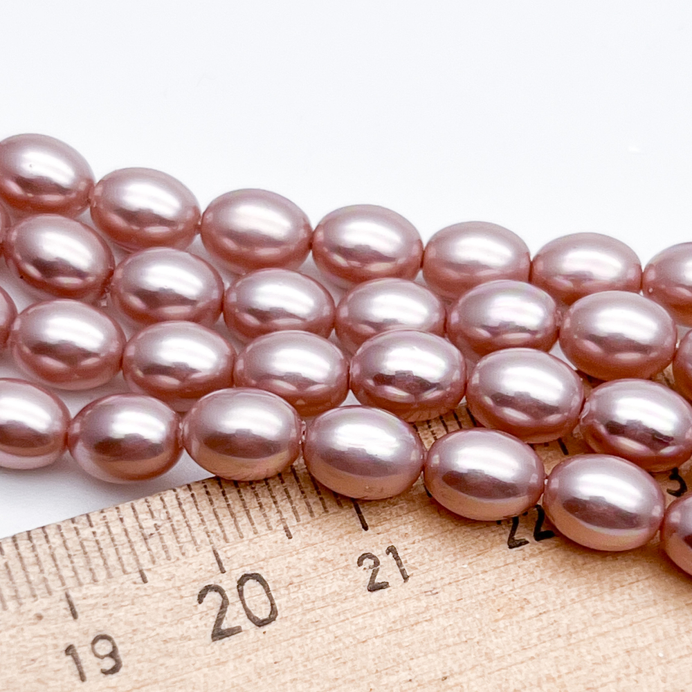 "Майорка" рис, цвет розовый, размер около 8*6 мм, цена за 24-25 шт (1/2 нити)